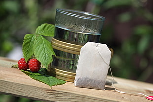 white teabag with glass cup